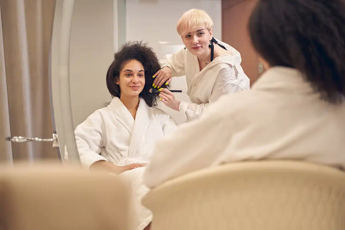 Adorable lady being pleased with the makeup